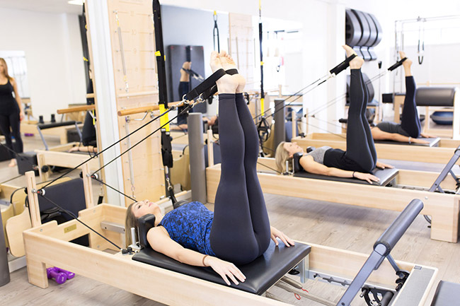 A leg workout using the reformer ropes