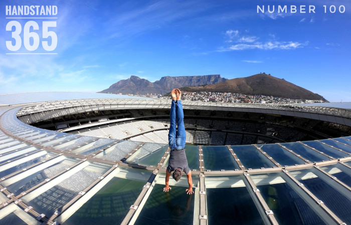 Man handstands on top of Cape Town Stadium