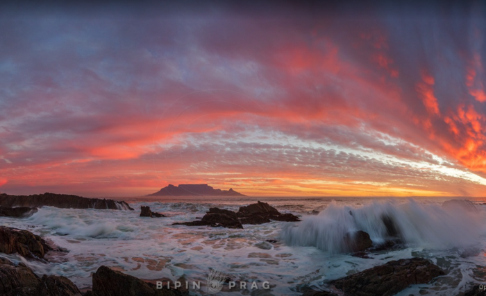A fiery autumn sun sets in Cape Town