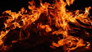 Strand coupled killed in fire, child escapes