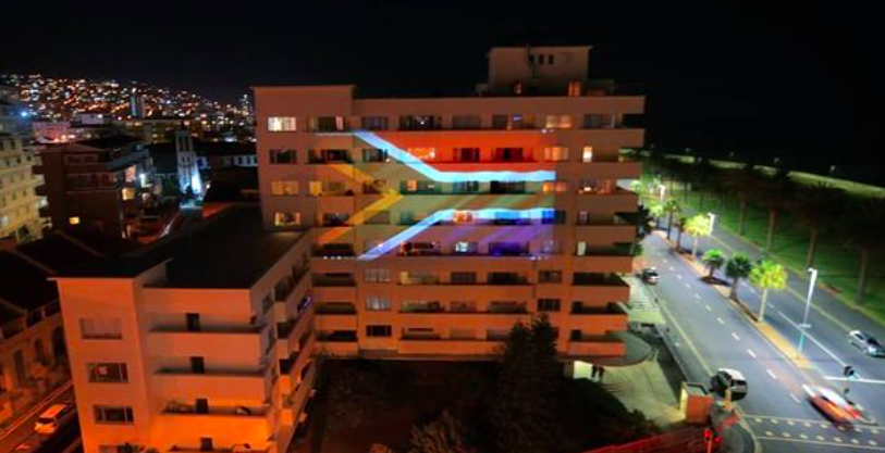 Sea Point Building lit up with SA Flag in solidarity message