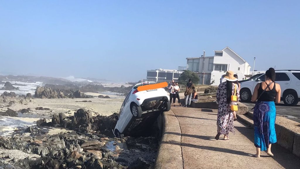 Vehicle rolled over the sidewalk into rocks at Bloubergstrand