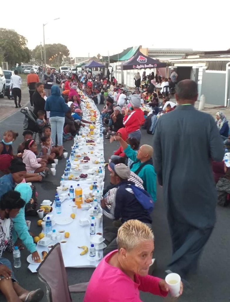 Mass feeding brings peaceful vibe to notorious community