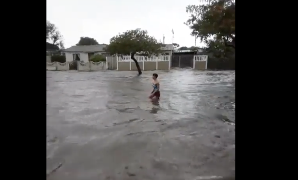 VIDEO: Heavy rains won't stop one woman from enjoying a good swim
