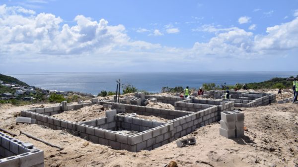 One of the houses for a Luyolo land claimant being built, taken in December 2022. Photo: Lucas Nowicki