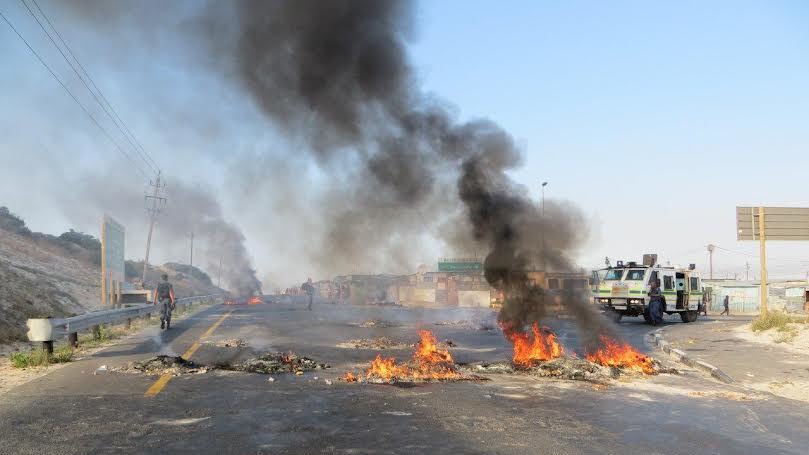 Protesters blocked major roads with burning tyres and rubbish and stones in an ongoing dispute with a cleaning company in Khayelitsha. Photo: Vincent Lali