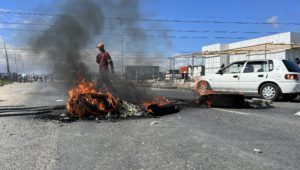 Potsdam Road in Dunoon was blocked with rubble and burning tyres by protesting community members on Tuesday. Photos: Peter Luhanga