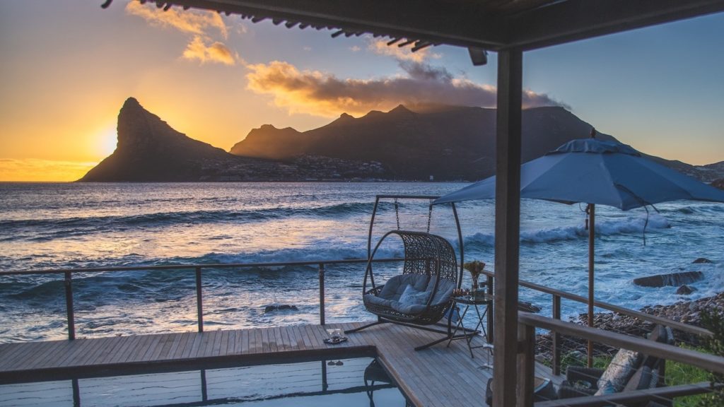 Toast to the sunset and the sea at Tintswalo Atlantic