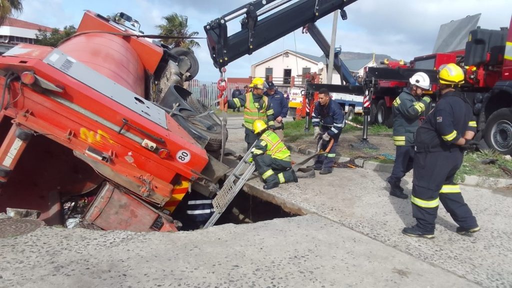 Pics: Refuse truck falls into collapsed road in Lavender Hill