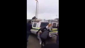 man dragged behind SAPS van
