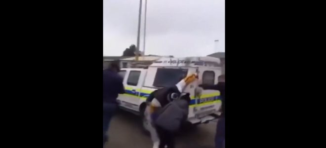 man dragged behind SAPS van