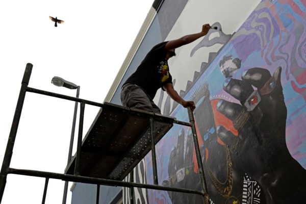 artist painting a mural