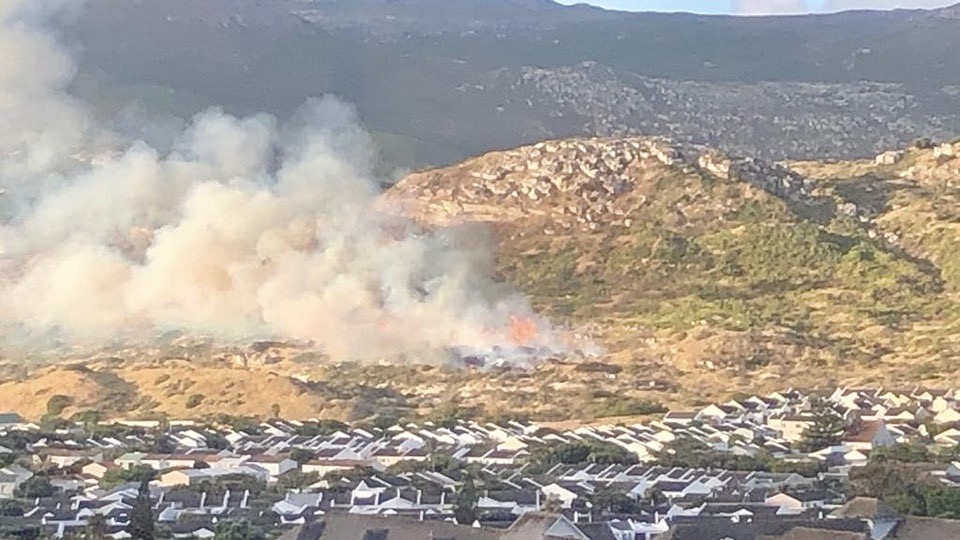 Firefighting services respond to a fire below Peers Hill in Fish Hoek